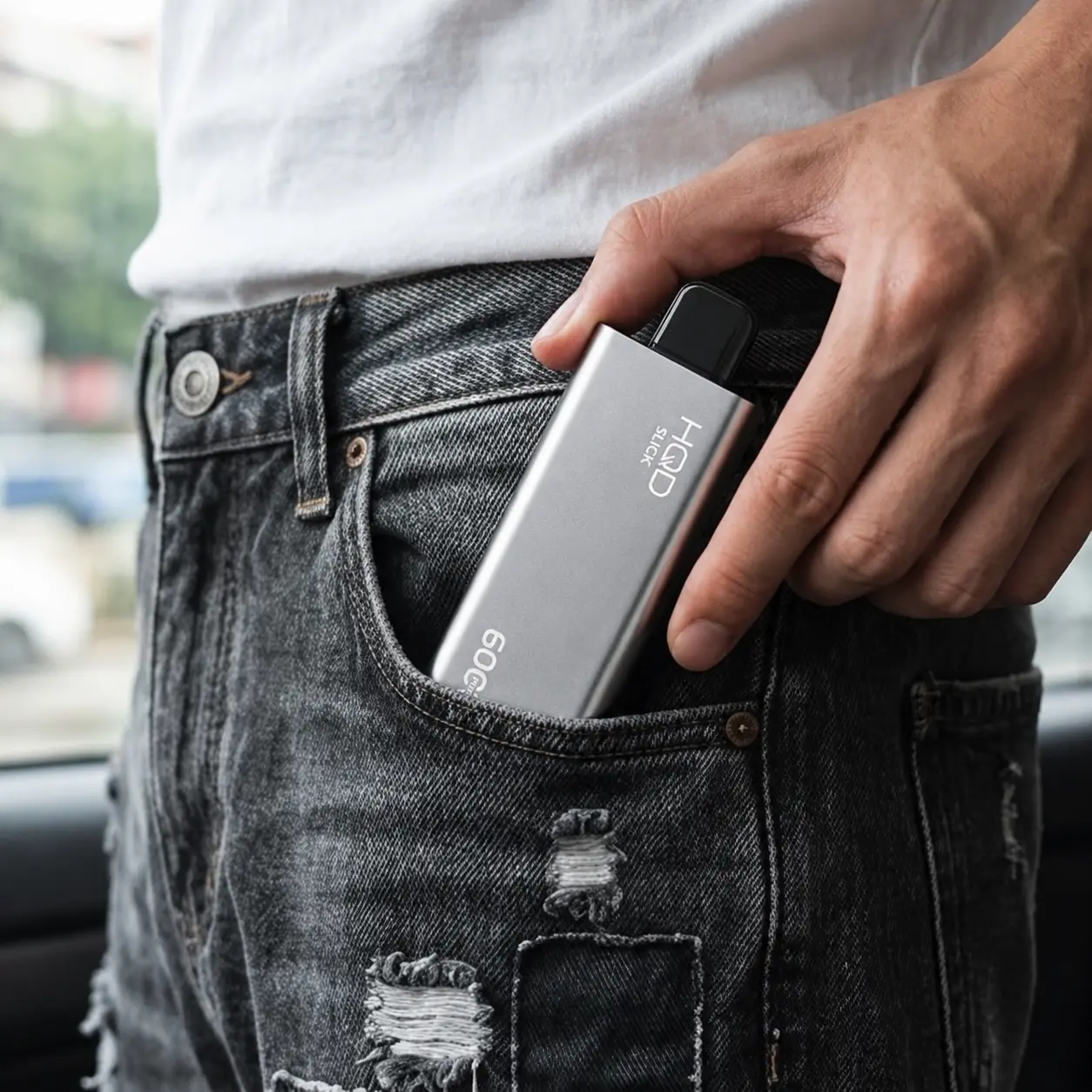 HQD Cuvie Slick slim device being slipped into a jeans pocket