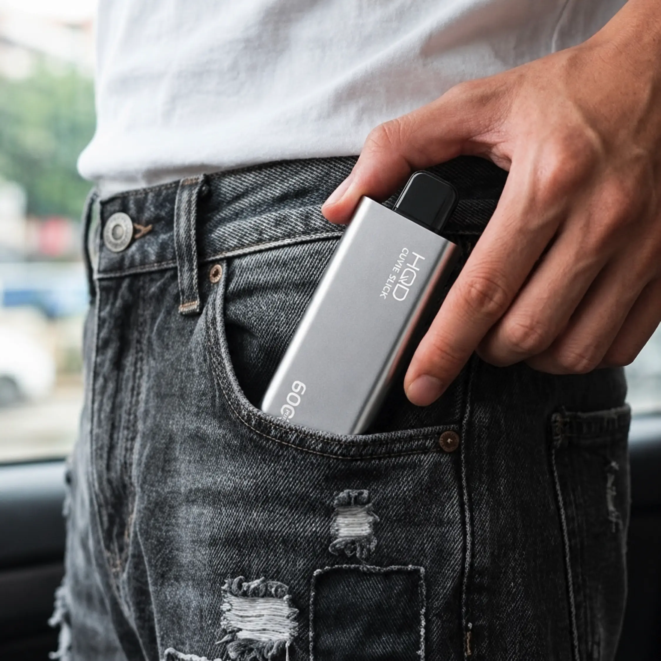 HQD Cuvie Slick slim device being slipped into a jeans pocket